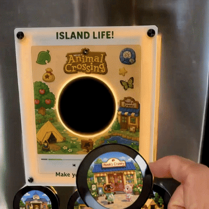 Hand placing disc onto CrossingCraft frame on fridge